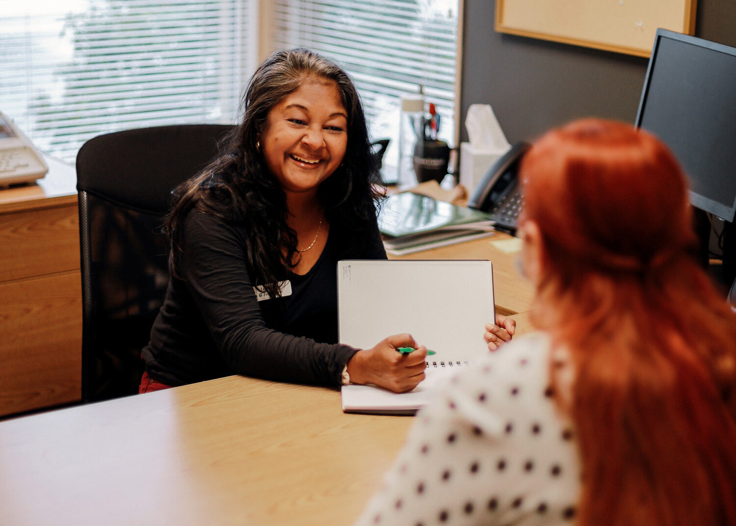 First Fed Branch Manager Luxmi Love reviews options with an account holder in Port Townsend.